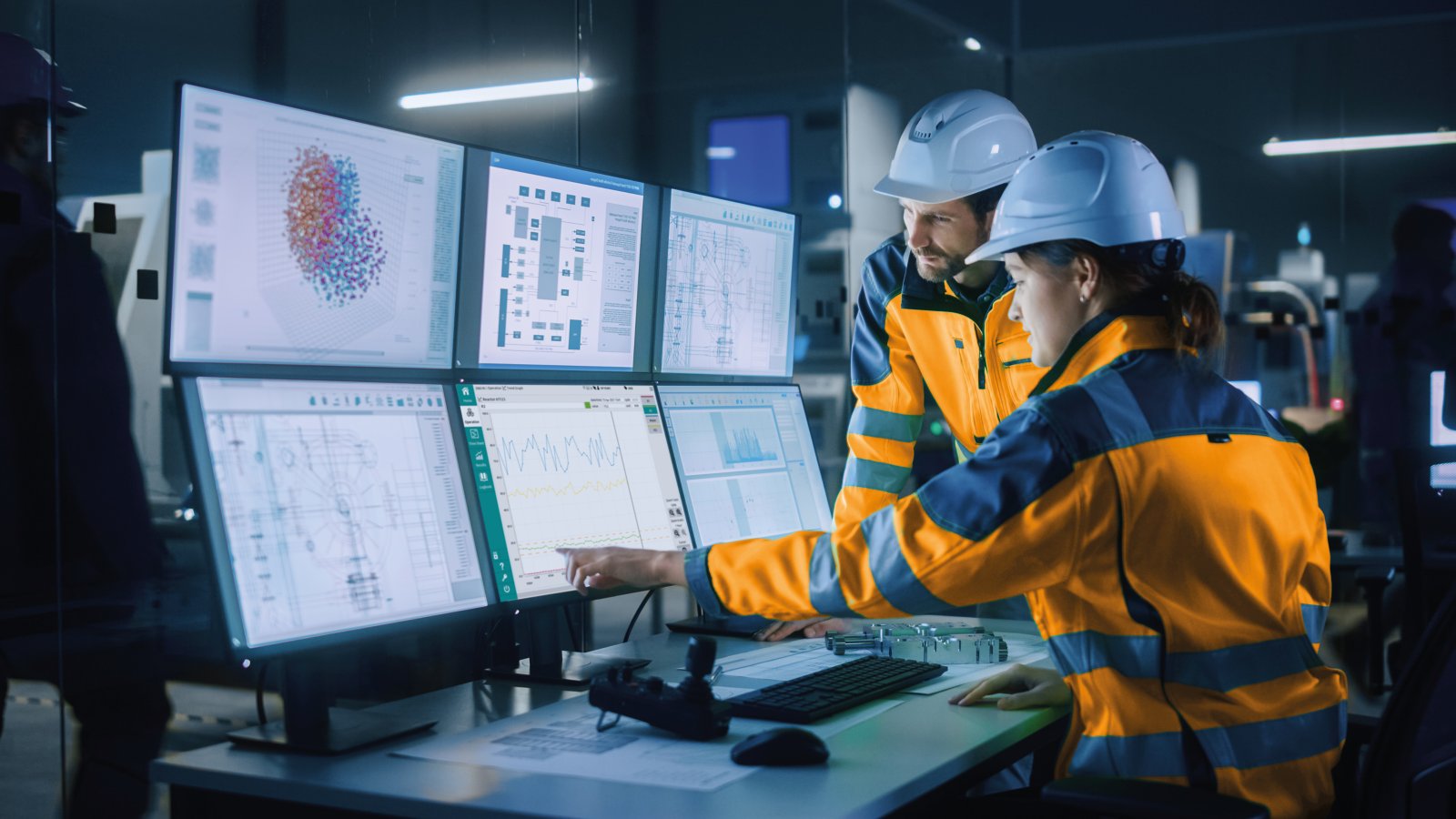 Industry 4.0 Modern Factory: Project Engineer Talks to Female Operator who Controls Facility Production Line, Uses Computer with Screens Showing AI, Machine Learning Enhanced Assembly Process