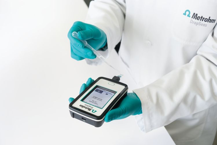 Example of a novel handheld setup where a miniaturized  ion-selective screen-printed electrode is utilized with a portable  potentiostat to make on-site measurements.