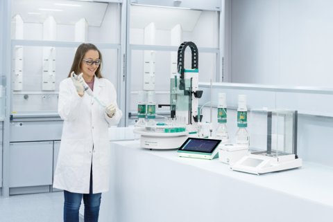 Lab technician working with the IONIC Titrator