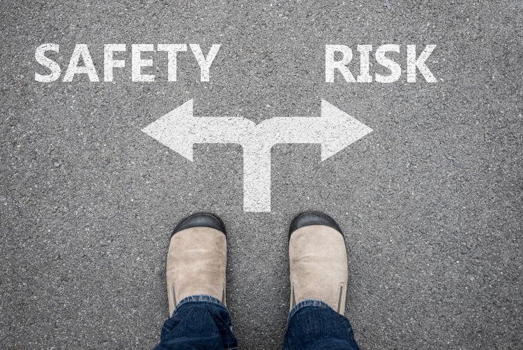 Brown shoes making decision at the cross road - safety or risk