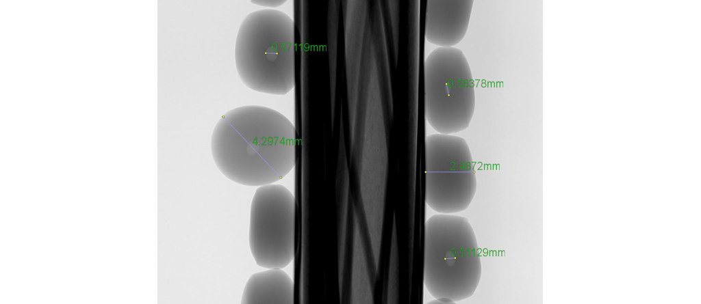 Example   of   computer   tomography   (CT)   scan   of   polyethylene  pellets  showing  air  bubbles  inside  the  polymer  granulate.