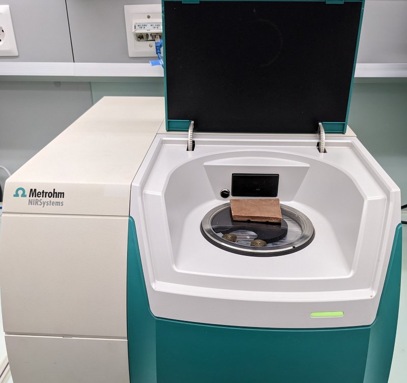 Metrohm NIRS DS2500 Solid Analyzer with a chocolate  bar covering the sample window. 