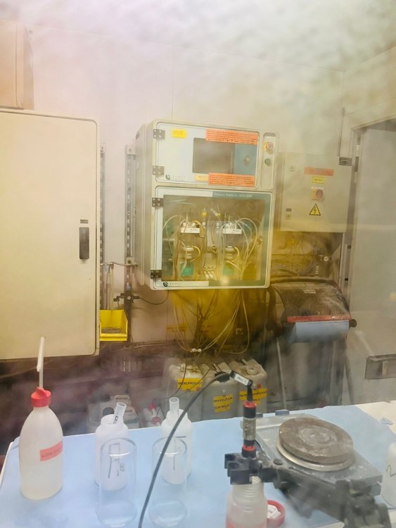 old process analyzer behind a glass front in a room