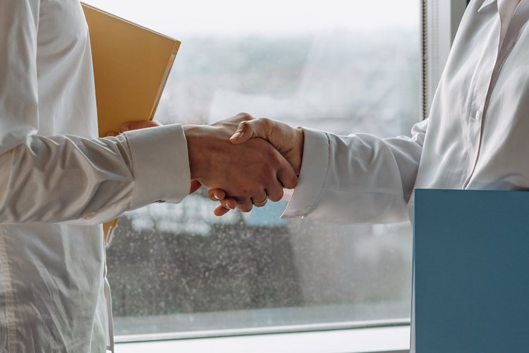 Close-up image of people shaking hands