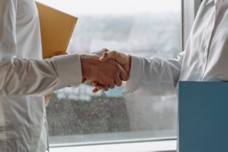 Close-up image of people shaking hands